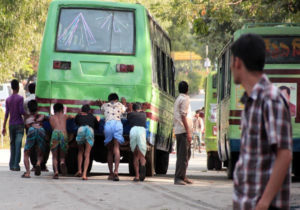 Green bus broken down on the road